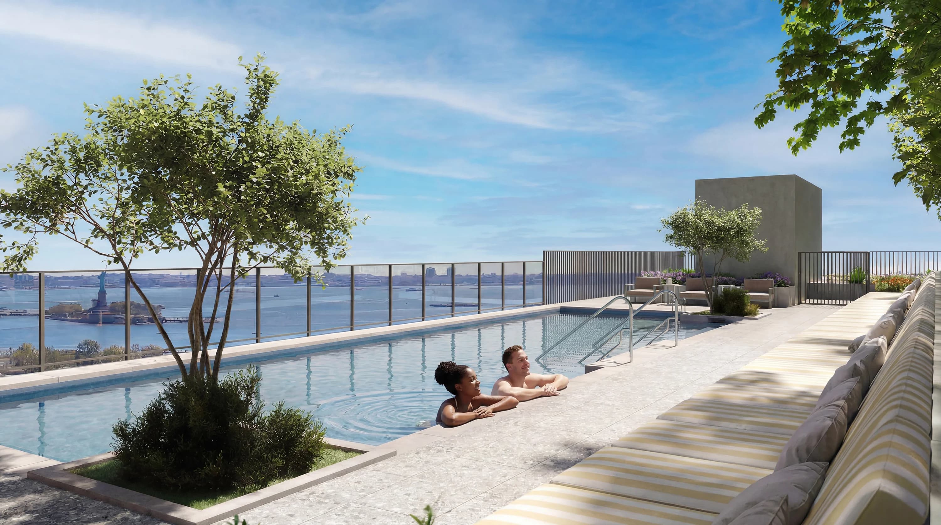 Guests relaxing and swimming at a rooftop pool abroad.